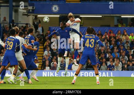 Stamford Bridge, Chelsea, London, UK. 30th Aug, 2023. EFL Carabao Cup Football, Chelsea versus AFC Wimbledon; Axel Disasi of Chelsea and Harry Pell of AFC Wimbledon compete for the header at a AFC Wimbledon corner. Credit: Action Plus Sports/Alamy Live News Stock Photo