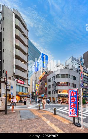 Pedestrians crossing the street in Ikebukuro, Tokyo, Japan