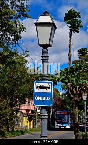 PETROPOLIS, RIO DE JANEIRO, BRAZIL - May 26, 2023: Bus stop sign on light pole Stock Photo