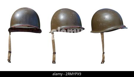 Vintage World War II United States army helmets at various angles isolated on a white background Stock Photo