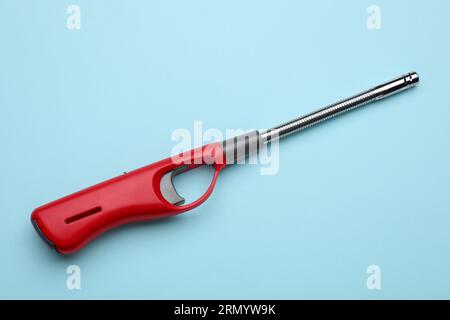 One gas lighter on light blue background Stock Photo