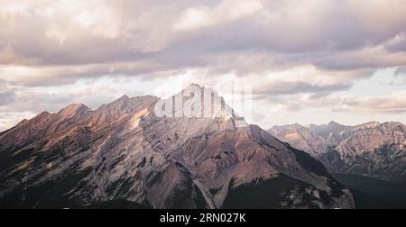 Photo of the Sulphur Mountain from the Banff Gondola patio on a warm, pink sunset. Stock Photo