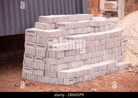 closeup of stack of small concrete bricks for building construction Stock Photo