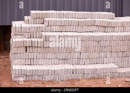 closeup of stack of small concrete bricks for building construction Stock Photo