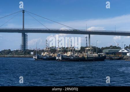 Pictures from the Port of Melbourne on a fine sunny day, focussing on tugboats berthed waiting for work. Stock Photo