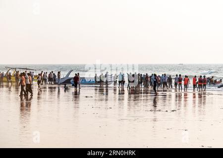 Calangute, Goa, India - January 2023: A large crowd of tourists at the popular Calangute beach in Goa. Stock Photo