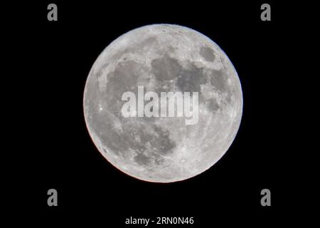 Los Angeles, United States. 30th Aug, 2023. The blue moon appears in the sky in Los Angeles. The moon was a rare blue supermoon, named so because it was the second full moon in August, thus the blue label, and it was unusually close to Earth, therefore a supermoon. Credit: SOPA Images Limited/Alamy Live News Stock Photo