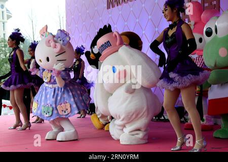 (141128) -- ANJI, Nov. 28, 2014 -- Staff members in cartoon character outfits stage a performance at a ceremony marking the completion of a Hello Kitty theme park in Anji, east China s Zhejiang Province, Nov. 28, 2014. The first of its kind in China, the Hello Kitty theme park in Anji is scheduled to open on Jan. 1, 2015, as more than a million visitors are expected per year. ) (lmm) CHINA-ZHEJIANG-ANJI-HELLO KITTY-THEME PARK-COMPLETION (CN) LixMingfang PUBLICATIONxNOTxINxCHN   Anji Nov 28 2014 Staff Members in Cartoon Character Outfits Stage a Performance AT a Ceremony marking The completion Stock Photo