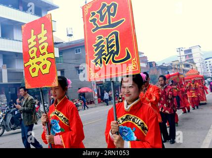 (141129) -- FUZHOU, Nov. 29, 2014 -- A street procession in which a bride is escorted to her groom s home takes place during a Chinese wedding in Daonan Village of Songkou Township in Yongtai County, southeast China s Fujian Province, Nov. 29, 2014. ) (lmm) CHINA-FUJIAN-LIFE-CHINESE WEDDING (CN) ZhangxGuojun PUBLICATIONxNOTxINxCHN   Fuzhou Nov 29 2014 a Street Procession in Which a Bride IS Escorted to her Groom S Home Takes Place during a Chinese Wedding in  Village of  Township in Yongtai County South East China S Fujian Province Nov 29 2014 lmm China Fujian Life Chinese Wedding CN ZhangxGuo Stock Photo