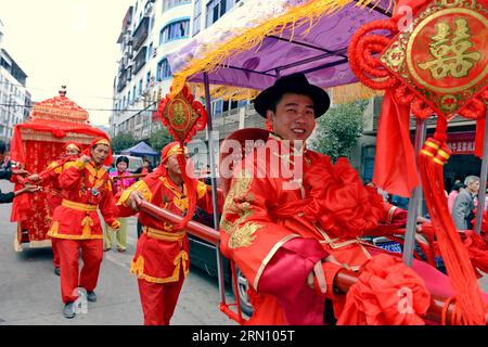 (141129) -- FUZHOU, Nov. 29, 2014 -- A groom and his bride (sitting inside a sedan chair covered with red curtains) are seen in a street procession during a Chinese wedding in Daonan Village of Songkou Township in Yongtai County, southeast China s Fujian Province, Nov. 29, 2014. ) (lmm) CHINA-FUJIAN-LIFE-CHINESE WEDDING (CN) ZhangxGuojun PUBLICATIONxNOTxINxCHN   Fuzhou Nov 29 2014 a Groom and His Bride Sitting Inside a Sedan Chair Covered With Red Curtains are Lakes in a Street Procession during a Chinese Wedding in  Village of  Township in Yongtai County South East China S Fujian Province Nov Stock Photo
