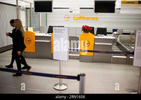 (141201) -- BERLIN, Dec. 1, 2014 -- Two staff members walk by Lufthansa s check-in desks in Tegel airport, Berlin, Germany, on Dec. 1, 2014. German airline Lufthansa said on Monday that it had canceled nearly half of its scheduled flights on Monday and Tuesday due to a strike by its pilots. ) GERMANY-BERLIN-LUFTHANSA-STRIKE ZhangxFan PUBLICATIONxNOTxINxCHN   Berlin DEC 1 2014 Two Staff Members Walk by Lufthansa S Check in desks in Tegel Airport Berlin Germany ON DEC 1 2014 German Airline Lufthansa Said ON Monday Thatcher IT had canceled parishioners Half of its scheduled Flights ON Monday and Stock Photo