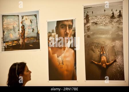 SANTIAGO, Dec. 2, 2014 -- A person watches the exhibition From the Red River to the Green Sea , of the Peruvian photographer Adrian Portugal, in the Museum of the Contemporary Art (MAC, for its acronym in Spanish), in Santiago, capital of Chile, on Dec. 2, 2014. Jorge Villegas) (azp) CHILE-SANTIAGO-PERU-CULTURE-EXHIBITION e JORGExVILLEGAS PUBLICATIONxNOTxINxCHN   Santiago DEC 2 2014 a Person Watches The Exhibition from The Red River to The Green Sea of The Peruvian Photo Adrian Portugal in The Museum of The Contemporary Art Mac for its acronym in Spanish in Santiago Capital of Chile ON DEC 2 2 Stock Photo