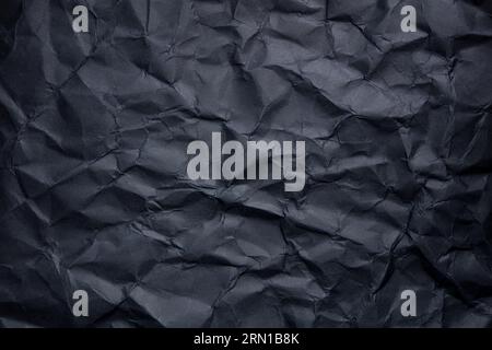 a black sheet of crumpled paper texture Stock Photo