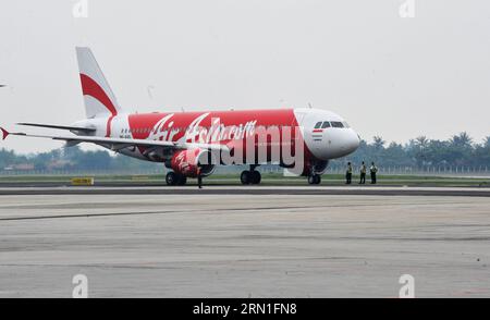 (141228) -- JAKARTA, Dec. 28, 2014 -- File photo taken on April 25, 2013 shows an Air Asia plane at Soekarno-Hatta airport in Jakarta, Indonesia. Air Asia said on Dec. 28, 2014 in a statement that its flight QZ8501 from Surabaya of Indonesia to Singapore lost contact with air traffic control at 07:24 in the morning (2324 Dec. 27 GMT). The A320-200 had 155 people onboard. Agung Kuncahya B.) INDONESIA-AIR ASIA PLANE-MISSING e yajiada PUBLICATIONxNOTxINxCHN   Jakarta DEC 28 2014 File Photo Taken ON April 25 2013 Shows to Air Asia Plane AT Soekarno Hatta Airport in Jakarta Indonesia Air Asia Said Stock Photo