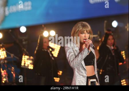 Singer Taylor Swift performs during the New Year s Eve celebration at Times Square in New York, the United States on Dec. 31, 2014. Times Square has been the center of worldwide attention on New Year s Eve for more than 100 years. The first Ball Lowering celebration occurred in 1907, and this tradition is now a universal symbol of welcoming the New Year. ) (lyi) US-NEW YORK-NEW YEAR EVE QinxLang PUBLICATIONxNOTxINxCHN   Singer Taylor Swift performs during The New Year S Eve Celebration AT Times Square in New York The United States ON DEC 31 2014 Times Square has been The Center of World Wide A Stock Photo