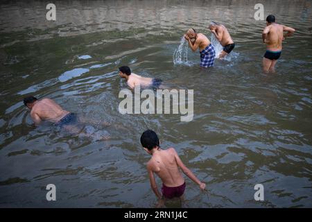 Kathmandu, Nepal. 31st Aug, 2023. Hindu devotees take a holy bath while performing rituals at Gokarneshor, Uttarbahini temple during the Janai Purnima festival. Janai Purnima also known as the Sacred Thread festival or Rakshya Bandhan festival, Hindu men, especially the Brahmans and Chettris, perform their annual change of Janai, sacred threads worn across the chest or tied around the wrist and Purified by mantras. The thread is a symbol of protection. (Photo by Prabin Ranabhat/SOPA Images/Sipa USA) Credit: Sipa USA/Alamy Live News Stock Photo