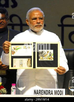 (150109) -- GANDHINAGAR, Jan. 8, 2015 -- Indian Prime Minister Narendra Modi shows the commemorative coin during the Pravasi Bharatiya Divas (PBD) in Gandhinagar, India, Jan. 8, 2015. PBD is an annual event to mark the contribution of non-resident Indian community for the development of India. ) (azp) INDIA-GANDHINAGAR-MODI-PBD Stringer PUBLICATIONxNOTxINxCHN   GANDHINAGAR Jan 8 2015 Indian Prime Ministers Narendra Modes Shows The Commemorative Coin during The  Bharatiya Divas  in GANDHINAGAR India Jan 8 2015  IS to Annual Event to Mark The Contribution of Non Resident Indian Community for The Stock Photo