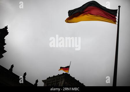 BERLIN, Jan. 09, 2015 -- German flag flies at half mast on the Reichstag building (the lower house of parliament) to commemorate the victims of the attack on French satirical weekly Charlie Hebdo , in Berlin, Germany, on Jan. 9, 2015. Twelve people were killed on Wednesday in a shooting at the Paris office of Charlie Hebdo weekly. ) GERMANY-BERLIN-PARIS ATTACK-MOURNING ZhangxFan PUBLICATIONxNOTxINxCHN   Berlin Jan 09 2015 German Flag FLIES AT Half Mast ON The Reichstag Building The Lower House of Parliament to commemorate The Victims of The Attack ON French satirical Weekly Charlie Hebdo in Be Stock Photo