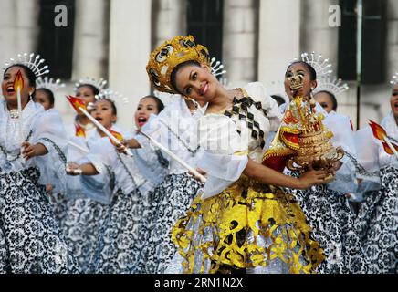 (150111) -- CEBU,  Students wearing colorful costumes participate in street dancing during the Sinulog Festival in Cebu Province, the Philippines, Jan. 11, 2015. The annual Sinulog Festival showcases street dancers in bright colored costumes dancing gracefully to the rhythm of drums, trumpets and native gongs while carrying miniature statues of Santo Nino. ) (zjy) PHILIPPINES-CEBU-SINULOG FESTIVAL Stringer PUBLICATIONxNOTxINxCHN   Cebu Students Wearing Colorful Costumes participate in Street Dancing during The Sinulog Festival in Cebu Province The Philippines Jan 11 2015 The Annual Sinulog Fes Stock Photo