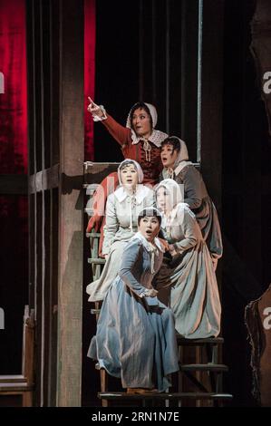 Performers stage a Chinese version of The Crucible , a drama by U.S. playwright Arthur Miller, in Beijing, capital of China, Jan. 11, 2015. The Crucible is a play on the Salem witch trials that took place in colonial Massachusetts between 1692 and 1693. This Chinese version is directed by Wang Xiaoying of the National Theatre of China. Its public performance is scheduled from Jan. 14 to 18 at the National Centre for the Performing Arts in Beijing. ) (lmm) CHINA-BEIJING-DRAMA-ARTHUR MILLER- THE CRUCIBLE (CN) LixYan PUBLICATIONxNOTxINxCHN   Performers Stage a Chinese Version of The Crucible a Dr Stock Photo