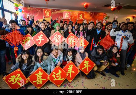(150119) -- HANGZHOU, Jan. 19, 2015 -- Students pose for a group photo at the opening ceremony of the winter club at Zhejiang University of Technology in Hangzhou, capital of east China s Zhejiang Province, Jan. 19, 2015. A winter club was created on Monday to provide cultural activities for over 300 students who are to spend the winter vacation and celebrate the Spring Festival at the university. The Spring Festival, or the Chinese traditional lunar New Year, starts on Feb. 19 this year. ) (hzy) CHINA-ZHEJIANG-COLLEGE STUDENTS-WINTER CLUB(CN) XuxYu PUBLICATIONxNOTxINxCHN   Hangzhou Jan 19 201 Stock Photo