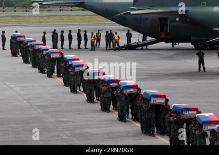 (150129) -- PASAY CITY, Jan. 29, 2015 -- Members of the Philippine National Police Special Action Force (PNP-SAF) carry the caskets of their fallen comrades at the Villamor Air Base in Pasay City, the Philippines, Jan. 29, 2015. Forty-four members of the PNP-SAF were killed allegedly by Moro Islamic Liberation Front and Bangsamoro Islamic Freedom Fighters members on Jan. 25 in Mamasapano, Maguindanao. ) PHILIPPINES-PASAY CITY-POLICE RouellexUmali PUBLICATIONxNOTxINxCHN   Pasay City Jan 29 2015 Members of The Philippine National Police Special Action Force PNP SAF Carry The casket of their Fall Stock Photo