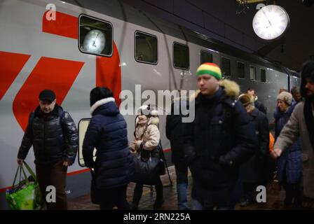 (150202) -- MOSCOW, Feb. 2, 2015 -- Passangers of the first double-decker train between Moscow and Saint. Petersburg arrive in Moscow, Russia, Feb. 2, 2015. The first trip from St. Petersburg to Moscow started on Feb. 1, 2015. The train runs daily. It departs from St. Petersburg at 22:50 and arrives in Moscow on the next day at 6:47 AM. ) RUSSIA-MOSCOW-DOUBLE-DECKER TRAIN PavelxBednyakov PUBLICATIONxNOTxINxCHN   Moscow Feb 2 2015 Pass Angers of The First Double Decker Train between Moscow and Saint Petersburg Arrive in Moscow Russia Feb 2 2015 The First Trip from St Petersburg to Moscow starte Stock Photo