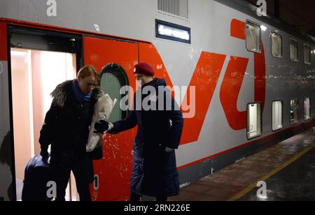 (150202) -- MOSCOW, Feb. 2, 2015 -- Passangers of the first double-decker train between Moscow and Saint. Petersburg arrive in Moscow, Russia, Feb. 2, 2015. The first trip from St. Petersburg to Moscow started on Feb. 1, 2015. The train runs daily. It departs from St. Petersburg at 22:50 and arrives in Moscow on the next day at 6:47 AM. ) RUSSIA-MOSCOW-DOUBLE-DECKER TRAIN PavelxBednyakov PUBLICATIONxNOTxINxCHN   Moscow Feb 2 2015 Pass Angers of The First Double Decker Train between Moscow and Saint Petersburg Arrive in Moscow Russia Feb 2 2015 The First Trip from St Petersburg to Moscow starte Stock Photo