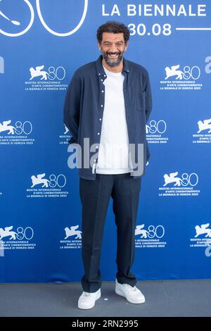 VENICE, ITALY - AUGUST 31: Ramzy Bedia, Xavier Giannoli, Olga Kurylenko