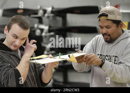 Engineering students construct their plane via some stationaries during the paper planes flying competition at the Aerospace Training Centre in Richmond, Canada, Feb. 27, 2015. Aircraft maintenance engineering students from British Columbia Institute of Technology participated in the 6th annual Wright Brothers Flying Extravaganza competition Friday. ) CANADA-VANCOUVER-PAPER PLANE-COMPETITION LiangxSen PUBLICATIONxNOTxINxCHN   Engineering Students construct their Plane Via Some  during The Paper Plan Flying Competition AT The Aerospace Training Centre in Richmond Canada Feb 27 2015 Aircraft Mai Stock Photo