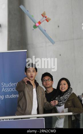 An engineering student launches his paper plane during the flying competition at the Aerospace Training Centre in Richmond, Canada, Feb. 27, 2015. Aircraft maintenance engineering students from British Columbia Institute of Technology participated in the 6th annual Wright Brothers Flying Extravaganza competition Friday. ) CANADA-VANCOUVER-PAPER PLANE-COMPETITION LiangxSen PUBLICATIONxNOTxINxCHN   to Engineering Student launches His Paper Plane during The Flying Competition AT The Aerospace Training Centre in Richmond Canada Feb 27 2015 Aircraft Maintenance Engineering Students from British Col Stock Photo