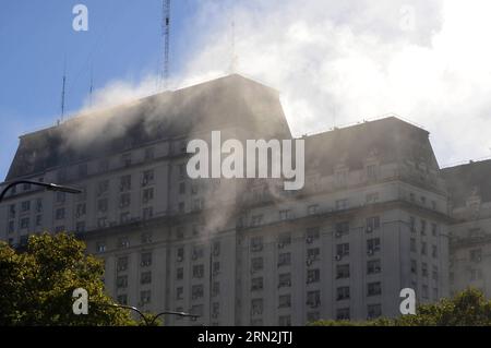 (150311) -- BUENOS AIRES, March 11, 2015 -- Smoke rises from a column of a building in Buenos Aires, Argentina, on March 11, 2015. The fire was caused by a short circuit in the electrical panel of one of the elevators in the building, so that all staff was evacuated, and so far no casualties were reported, according with local press information. Victoria Egurza/TELAM) (jg) ARGENTINA-BUENOS AIRES-ACCIDENT-FIRE e TELAM PUBLICATIONxNOTxINxCHN   Buenos Aires March 11 2015 Smoke Rises from a Column of a Building in Buenos Aires Argentina ON March 11 2015 The Fire what CAUSED by a Short Circuit in T Stock Photo