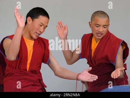 (150317) -- SHANGRI-LA, March 17, 2015 -- File photo taken on March 15, 2010 shows monks debating on Tibetan Buddhism doctrines at the Yunnan Institute of Buddhist Studies Diqing Branch in Shangri-la County, southwest China s Yunnan Province. Located at an altitude of 3,300 meters, Yunnan Institute of Buddhist Studies Diqing Branch is an important school of Tibetan Buddhism in Yunnan. Established in 2005, the institute now has a total of 68 monks, who are from some monasteries in Yunnan, Sichuan and Tibet. Besides daily chanting sutras, monks here also take classes such as Tibetan language, Ch Stock Photo