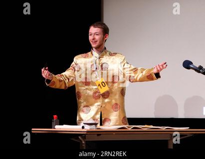Cameron Patterson from Lancaster University performs during the final of the 14th Chinese Bridge Chinese Proficiency Competition UK 2015 held in British Library Conference Center in London, Britain, on March 21, 2015. ) BRITAIN-LONDON-14TH CHINESE BRIDGE-CHINESE PROFICIENCY COMPETITION UK 2015 HanxYan PUBLICATIONxNOTxINxCHN   Cameron Patterson from Lancaster University performs during The Final of The 14th Chinese Bridge Chinese Proficiency Competition UK 2015 Hero in British Library Conference Center in London Britain ON March 21 2015 Britain London 14th Chinese Bridge Chinese Proficiency Com Stock Photo