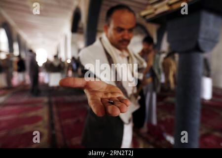 (150323) -- SANAA, March 23, 2015 -- A man shows shrapnel at a mosque that was targeted by Friday suicide bombings in Sanaa, Yemen, on March 23, 2015. The Yemeni people held a funeral for those who were killed in suicide bombing attacks in Sanaa on Friday. The Islamic State launched four bombing attacks in Yemen on Friday that killed at least 154 people and wounded 350 others. ) YEMEN-SANAA-ATTACKS-VICTIMS-FUNERAL HanixAli PUBLICATIONxNOTxINxCHN   Sanaa March 23 2015 a Man Shows shrapnel AT a Mosque Thatcher what targeted by Friday Suicide bombings in Sanaa Yemen ON March 23 2015 The Yemeni Ce Stock Photo
