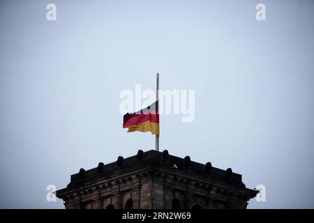 (150325) -- BERLIN, March 25, 2015 -- A German national flag flies at half mast on the Reichstag building (the lower house of parliament) to commemorate the victims of the crashed plane of Germanwings in Berlin, Germany, on March 25, 2015. An Airbus A320 of the German low-cost airline Germanwings with 150 people on board crashed on Tuesday in southern France. ) GERMANY-BERLIN-AIRBUS A320 CRASH-MOURNING ZhangxFan PUBLICATIONxNOTxINxCHN   Berlin March 25 2015 a German National Flag FLIES AT Half Mast ON The Reichstag Building The Lower House of Parliament to commemorate The Victims of The Crashe Stock Photo