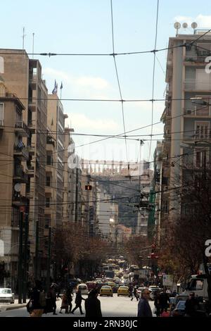 (150331) -- ATHENS, March 31, 2015 -- The Acropolis hill is seen between blocks of flats and stores in central Athens, Greece, on March 31, 2015. Debt-laden Greece inaugurated in May 2013 the procedure to obtain residence permits, which can be renewed every five years, for third-country citizens who own real estate projects with a value surpassing 250,000 euros (about 268,420 U.S. dollars). Investors can explore opportunities in this real estate for visa program, despite the country s financial challenges of recent months and other obstacles. ) GREECE-ATHENS-REAL ESTATE FOR VISA-PROGRAM Marios Stock Photo