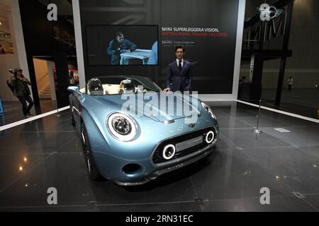 (150402) -- ILSAN, April 2, 2015 -- A model poses beside a BMW Mini s Superleggera during a media preview at the Seoul Motor Show in Ilsan, Gyeonggi Province of South Korea, April 2, 2015. Seoul Motor Show will officially kick off Friday at the Korea International Exhibition Center in Ilsan. ) SOUTH KOREA-ILSAN-MOTOR SHOW SeongbinxKang PUBLICATIONxNOTxINxCHN   Ilsan April 2 2015 a Model Poses Beside a BMW Mini S Superleggera during a Media Preview AT The Seoul Engine Show in Ilsan Gyeonggi Province of South Korea April 2 2015 Seoul Engine Show will officially Kick off Friday AT The Korea Inter Stock Photo