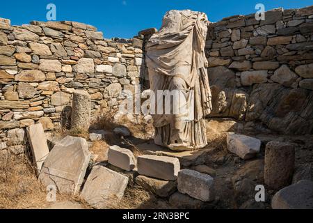 Greece, Cyclades, Delos Island listed UNESCO World Heritage, archaeological site of Delos, the biggest ancient city of Egee sea, theatre quarter, Cleopatre House, sculpture Stock Photo