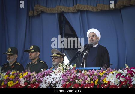 (150418) -- TEHRAN, April 18, 2015 -- Iranian President Hassan Rouhani (R) delivers a speech during the Army Day parade in Tehran, Iran, on April 18, 2015. Different units of Iranian army staged parades in a ceremony to show the latest Iranian military achievements. ) IRAN-TEHRAN-ARMY DAY-PARADE AhmadxHalabisaz PUBLICATIONxNOTxINxCHN   TEHRAN April 18 2015 Iranian President Hassan Rouhani r delivers a Speech during The Army Day Parade in TEHRAN Iran ON April 18 2015 different Units of Iranian Army staged Parades in a Ceremony to Show The Latest Iranian Military Achievements Iran TEHRAN Army Da Stock Photo
