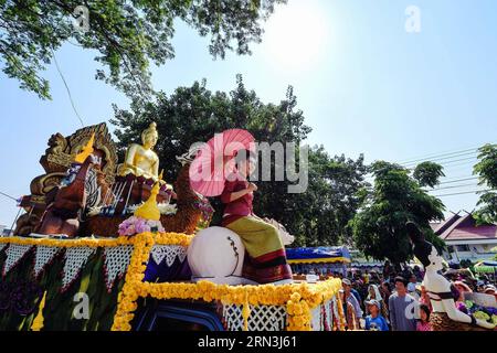 CHIANG SAEN, April 18, 2015 -- A candidate for Miss Songkran takes a float car ride during a Songkran festival celebration in Chiang Saen district, Chiang Rai Province, north Thailand, on April 18, 2015. The festive mood of Songkran, which marks the beginning of New Year in the Thai calendar, still persists in some regions of Thailand. In Chiang Saen, a border district between Thailand and Laos, Songkran festival celebrations will last until April 18. ) (dzl) THAILAND-CHIANG SAEN-SONGKRAN FESTIVAL-CELEBRATION LixMangmang PUBLICATIONxNOTxINxCHN   Chiang Sowing April 18 2015 a Candidate for Miss Stock Photo