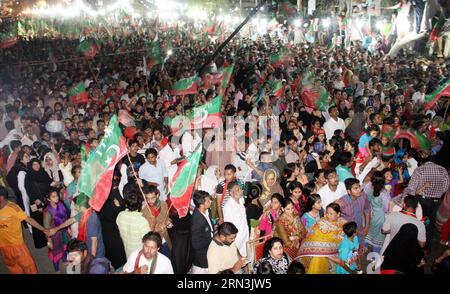 (150420) -- KARACHI, April , 2015 -- Supporters of Pakistan Tehrik-e-Insaf (PTI) or Justice Movement wave party flags during a by-election campaign rally in southern Pakistani port city of Karachi, April 19, 2015. Pakistan s ruling party agreed last month to form a judicial commission to investigate alleged rigging in the 2013 general elections after months of negotiations with Imran Khan, who leads PTI. ) PAKISTAN-KARACHI-PTI-IMRAN KHAN Masroor PUBLICATIONxNOTxINxCHN   Karachi April 2015 Supporters of Pakistan Tehrik e Insaf PTI or Justice Movement Wave Party Flags during a by ELECTION Campai Stock Photo