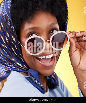 Fun, retro and woman with sunglasses and smile closeup with vintage frames accessories in studio. African female model, confidence and happy person Stock Photo