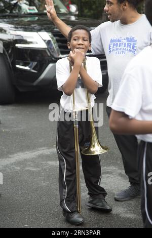 Empire Marching Elite marches and plays at the annual Hip Hop Parade for Social Justice celebrating the 50th anniversary of Hip Hop through  Bedford Stuyvesant, Brooklyn, New York. Stock Photo