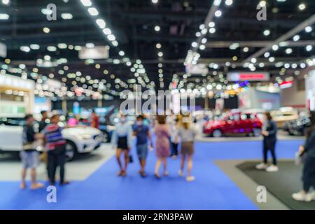 A mesmerizing tapestry of blurred hustle in a trade hall. A fusion of aspirations and opportunities, where connections shape destinies. Stock Photo