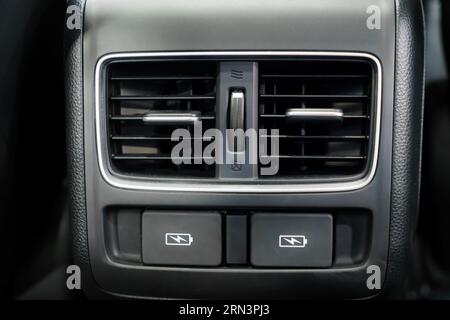 Zoom in on car panel's USB port, a tech oasis amidst leather and chrome. Power and connectivity elegantly fuse, inviting endless journeys. Stock Photo