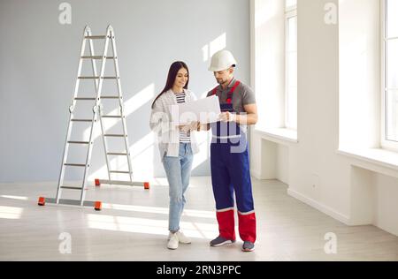 Foreman and home owner discussing house design construction plan Stock Photo