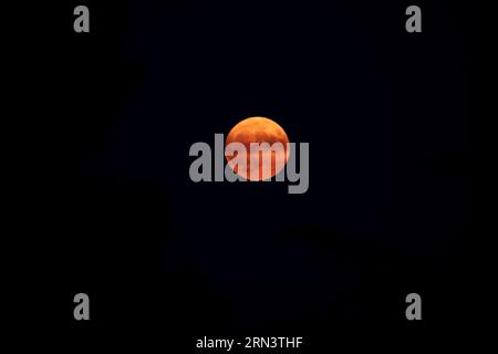 Red or Blood Moon in South of France on March 30th, 2023 Stock Photo