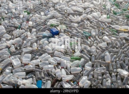 Plastic waste in floating on the surface of water pollution. Sea of plastic waste . Stock Photo