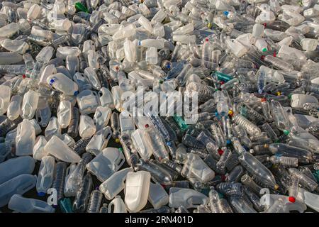 Plastic waste in floating on the surface of water pollution. Sea of plastic waste . Stock Photo